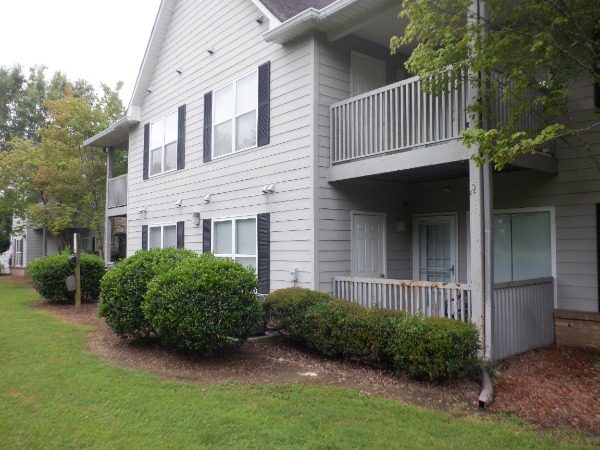 exterior of condo building with rusted balcony railings Preview Image 5