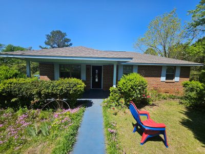 brick house with painted wood trim