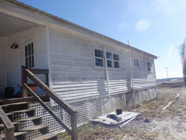 rear of house with worn exterior paint Preview Image 5