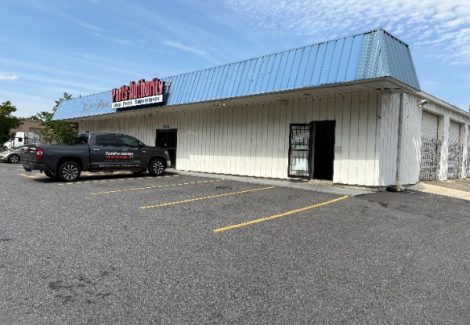 commercial building with worn metal siding