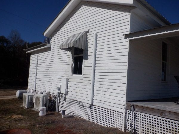 left side of house with worn painted siding Preview Image 4