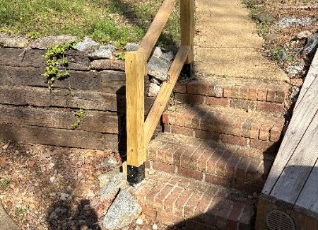 brick steps with wood handrail