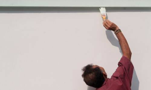 Man Painting Stucco