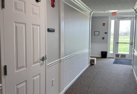 painted apartment hallway with outside entrance door