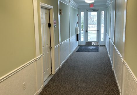 apartment hallway with outside entrance door
