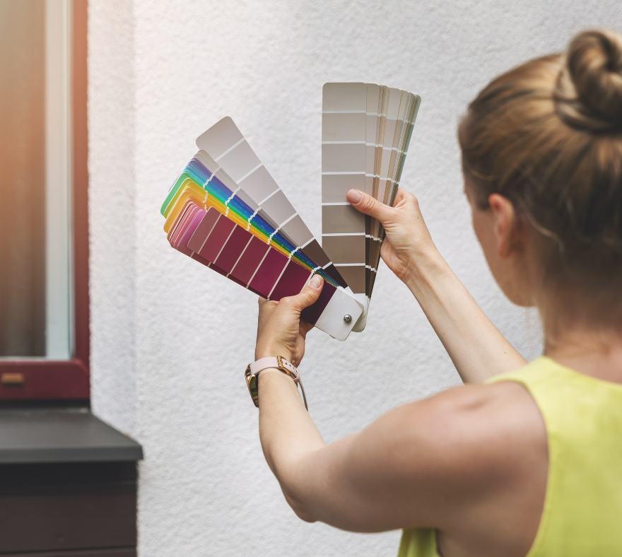 Homeowner choosing exterior stucco paint colors