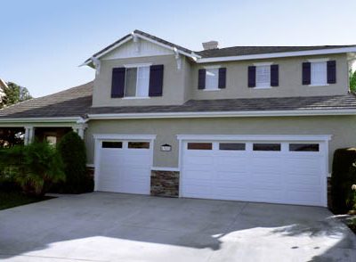 Two story house with dark shutters and white trim in Temecula, CA.