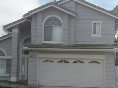 Gray house with white trim looks great.