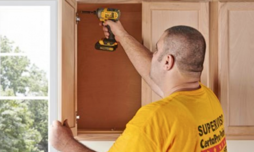 man removing cabinet to be painted