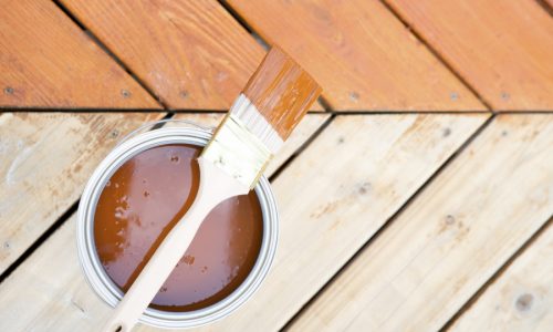 Staining a deck with a brush