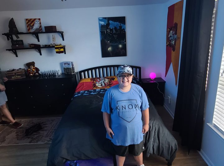 Trent with his newly decorated Harry Potter themed bedroom!