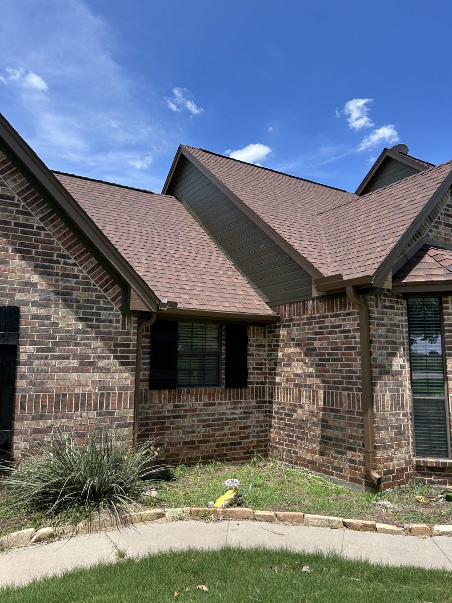 front corner view of house with stone facade and painted siding Preview Image 1