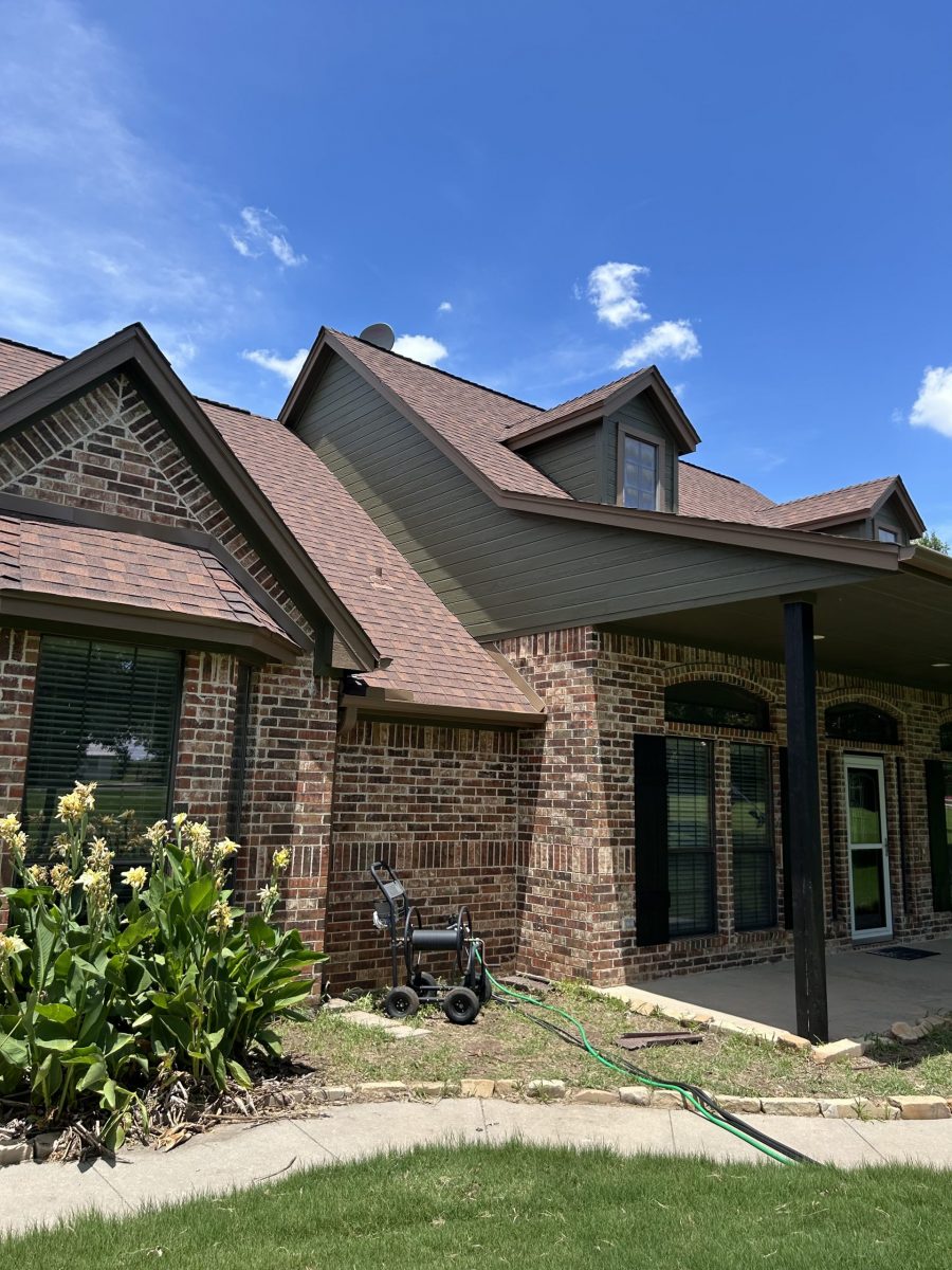 front corner view of house with stone facade and painted siding Preview Image 4