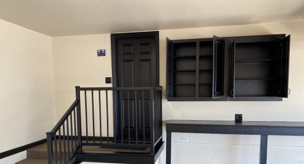 garage interior with black painted cabinets and accents