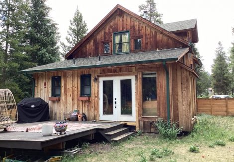 unpainted cabin style house