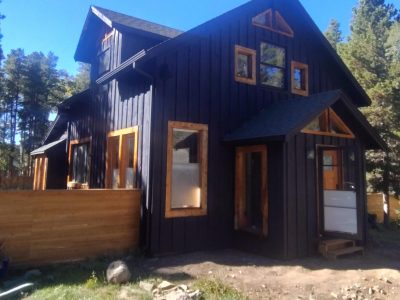 black painted cabin style house
