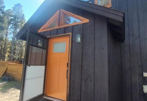 black painted cabin style house