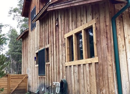 unpainted cabin style house