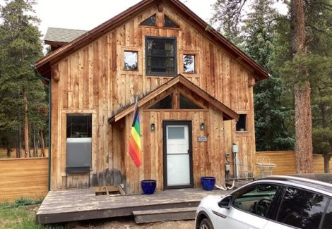 unpainted cabin style house