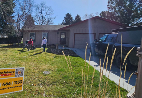 painters in front yard of house