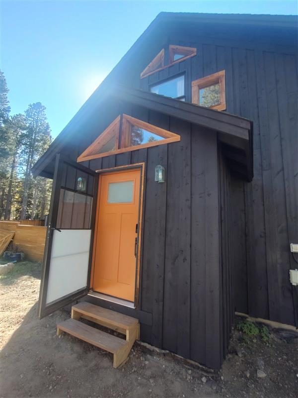 black painted cabin style house Preview Image 1