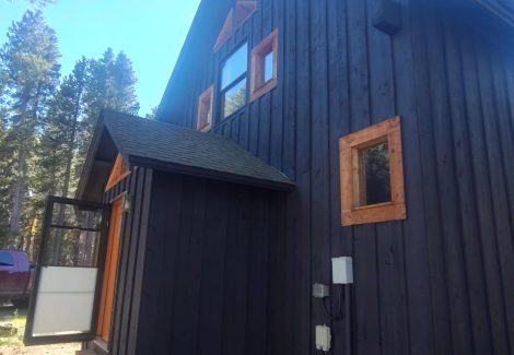 black painted cabin style house