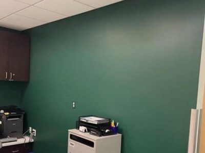 reception area of doctors office with freshly painted green wall
