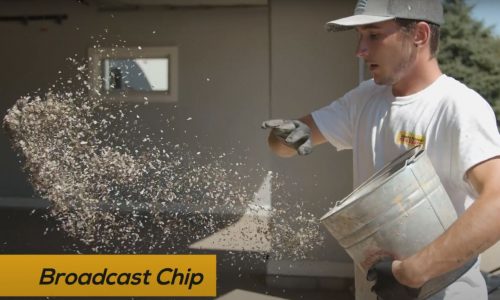 man spreading chips on a new epoxy floor