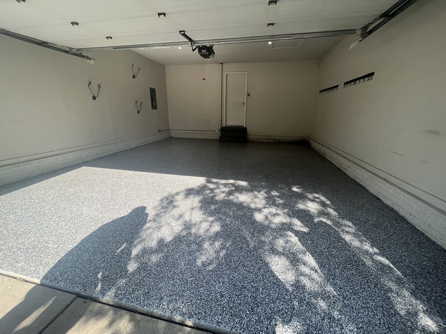 Residential garage floor coating project, after applying the polyaspartic