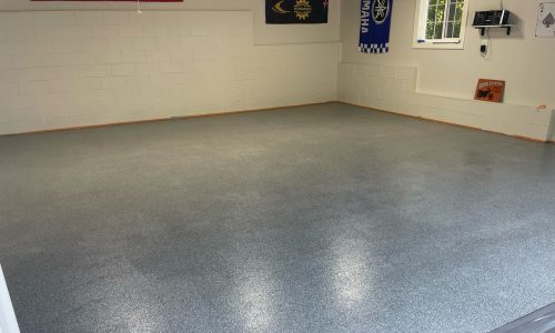 Shot of a garage floor after the application of a polyaspartic coating