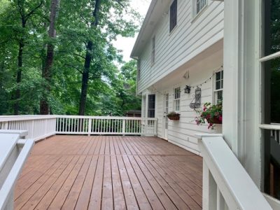 semi stain on deck floor and solid stain on rails - certapro painters of dunwoody