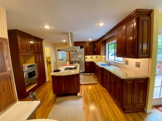 photo of cabinets before being repainted Preview Image 1