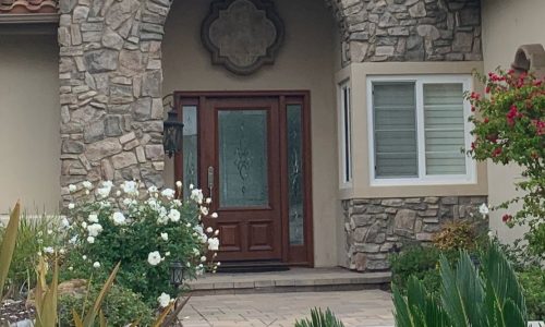A stone and stucco entry
