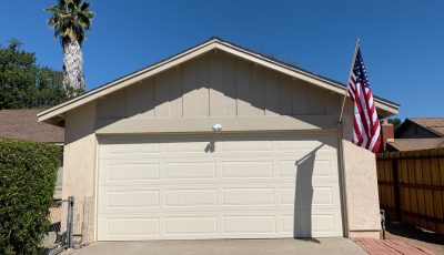 Garage after wood trim replacement and repainting.