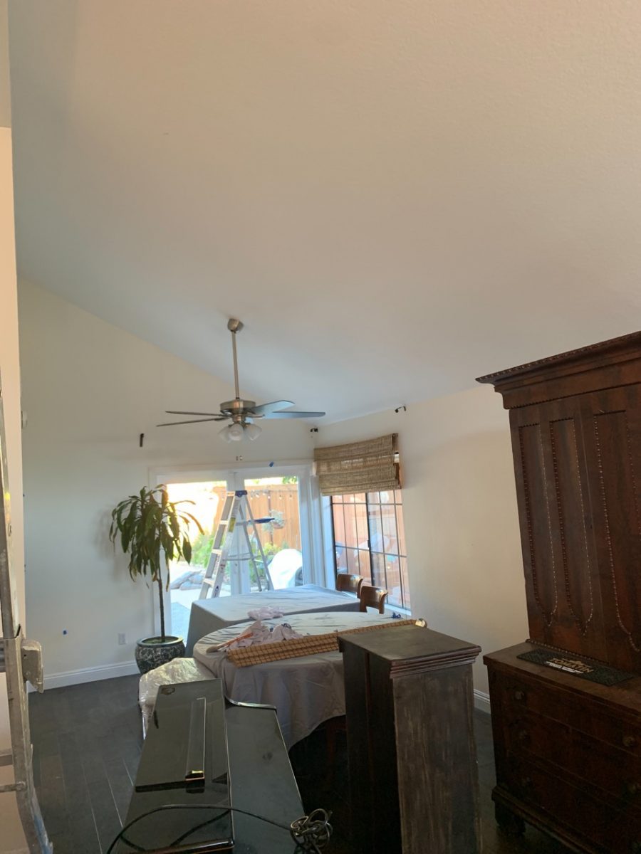 moving furniture to prepare for wall painting. Preview Image 5