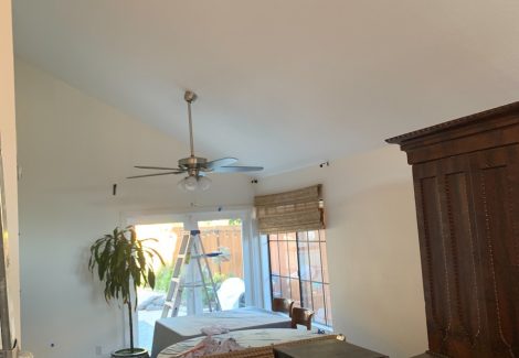 moving furniture to prepare for wall painting.