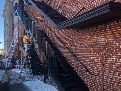 Painting the stairs of the Bijou Theater