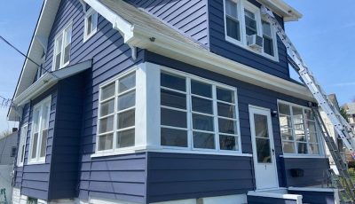 house painted dark blue with white trim