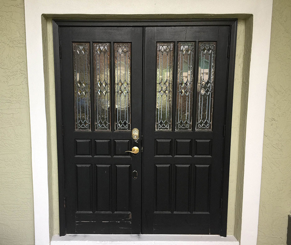 Before photo of a repainted door in Oviedo, FL