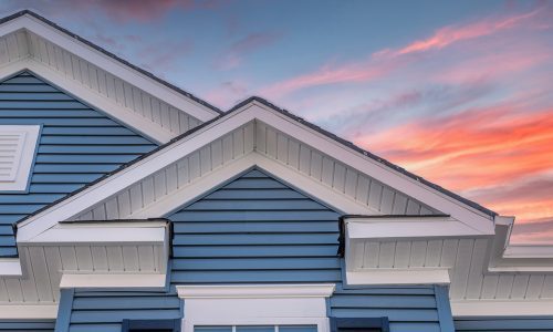 siding painting at sunset