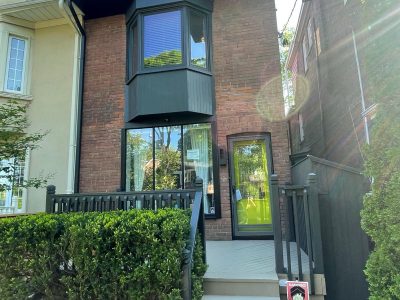 painted black trim on brick home