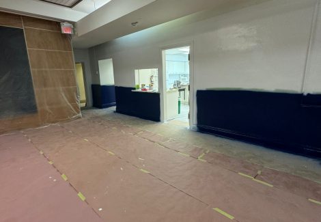 school gym flooring covered in paper for wall paint update
