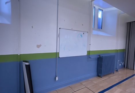 school gym wall with chipped paint