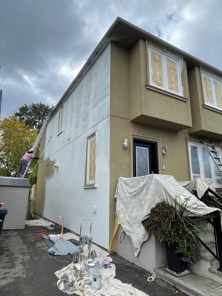 tan stucco home during white exterior repaint Preview Image 8