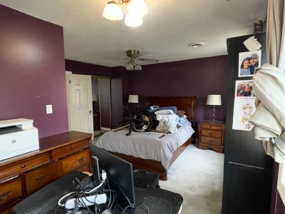 bedroom with deep purple painted walls