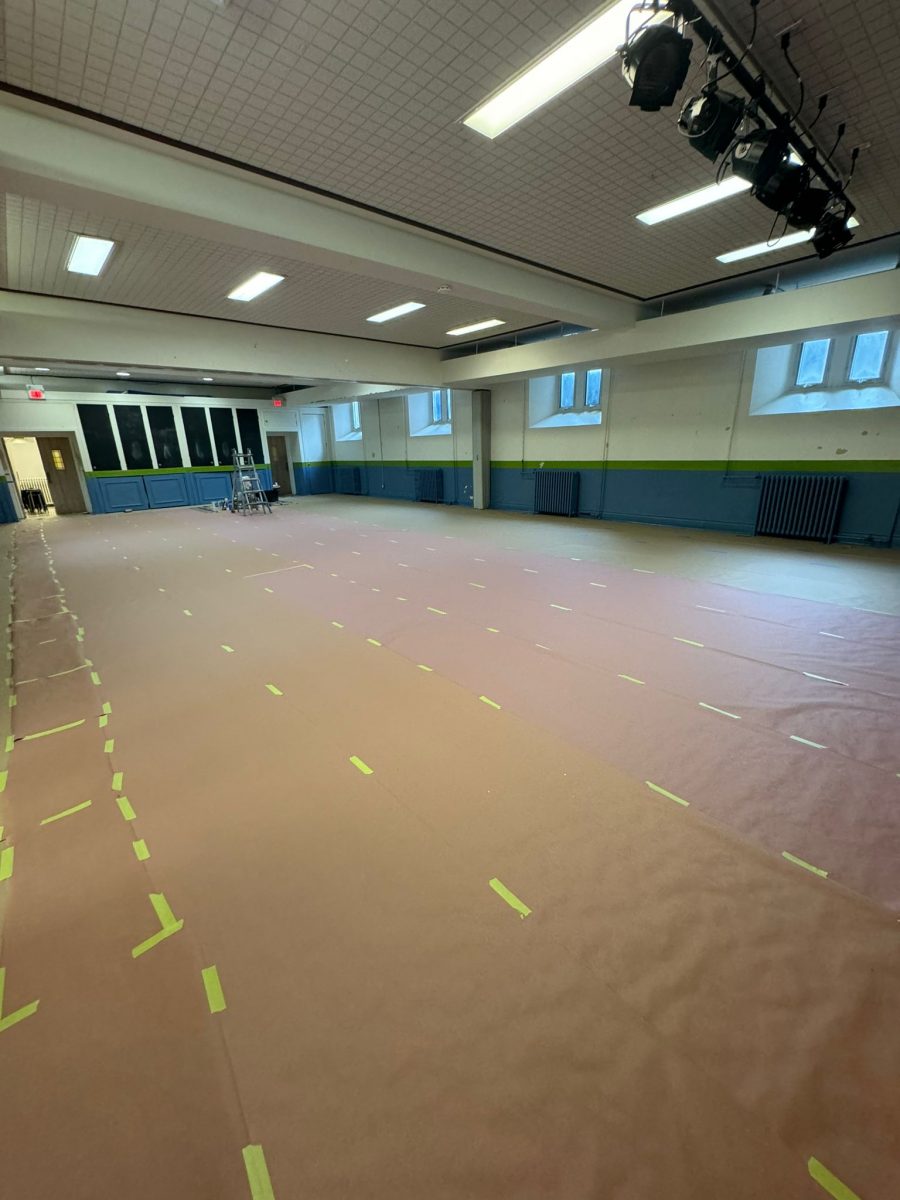 wide angle view of school gym with floor covered for painting project Preview Image 12