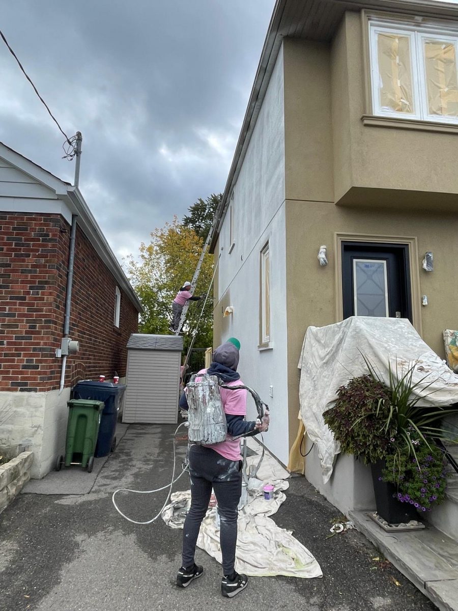 tan stucco home during white exterior repaint Preview Image 7