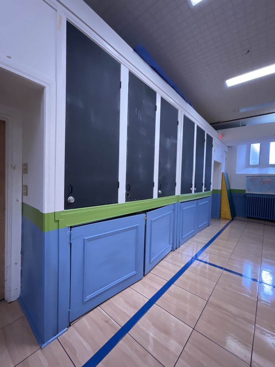 cabinets along school gymnasium wall with faded paint Preview Image 14