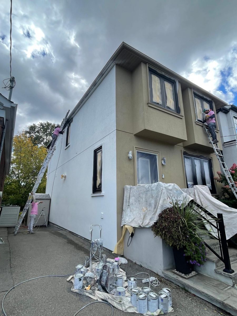 painters on ladder against stucco home during repaint Preview Image 5