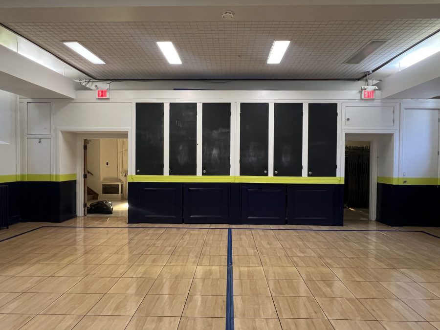 chalkboard-front cabinets inside repainted school gym Preview Image 6